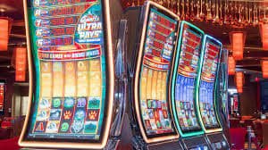 Colourful online slot game reels displayed on a mobile phone screen
